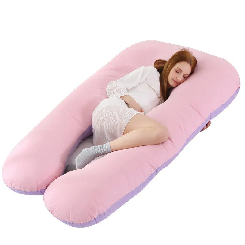 Large U-shaped pregnancy support pillow with removable cover and abdominal support belt.