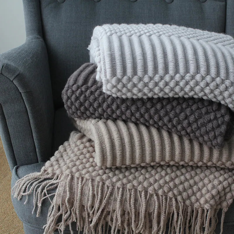Small grey polyester fibre nap blanket folded, showing dimensions of 127 cm by 170 cm.