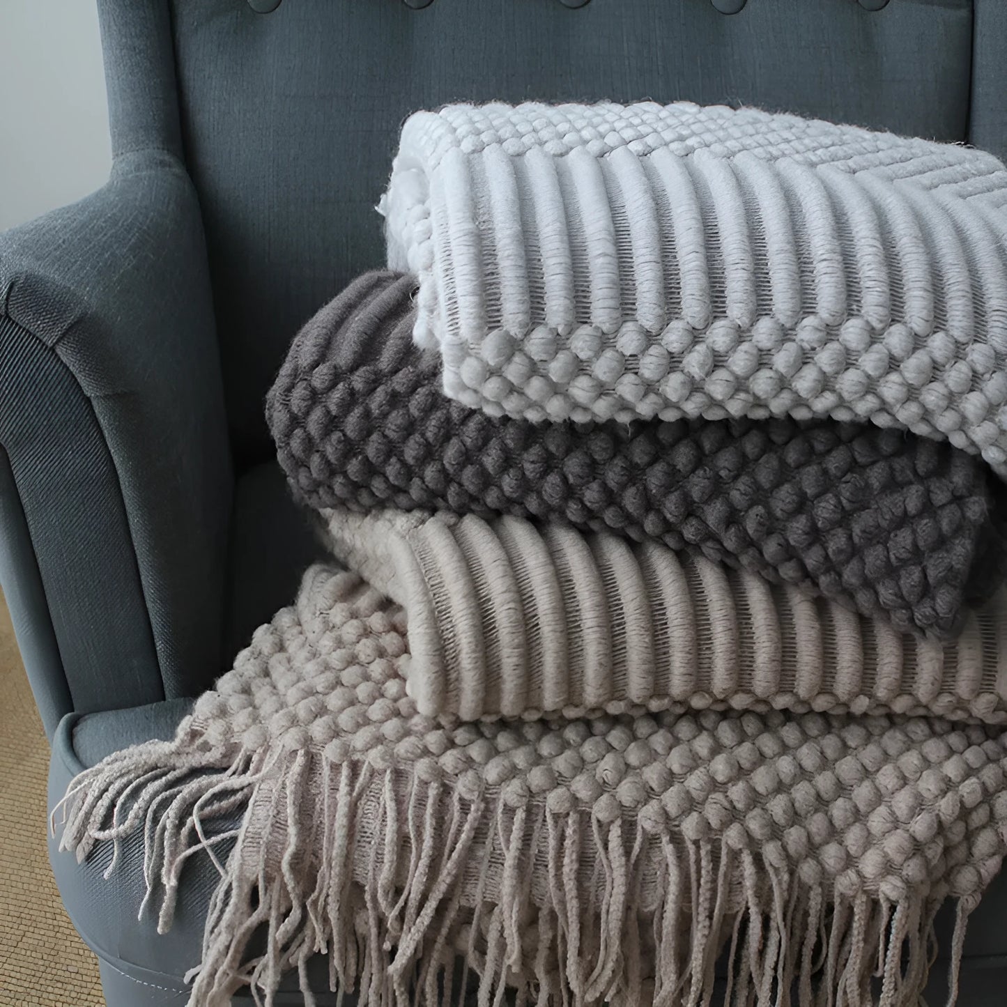 Polyester small blanket shown in dark grey, measuring 127 by 170 centimetres.