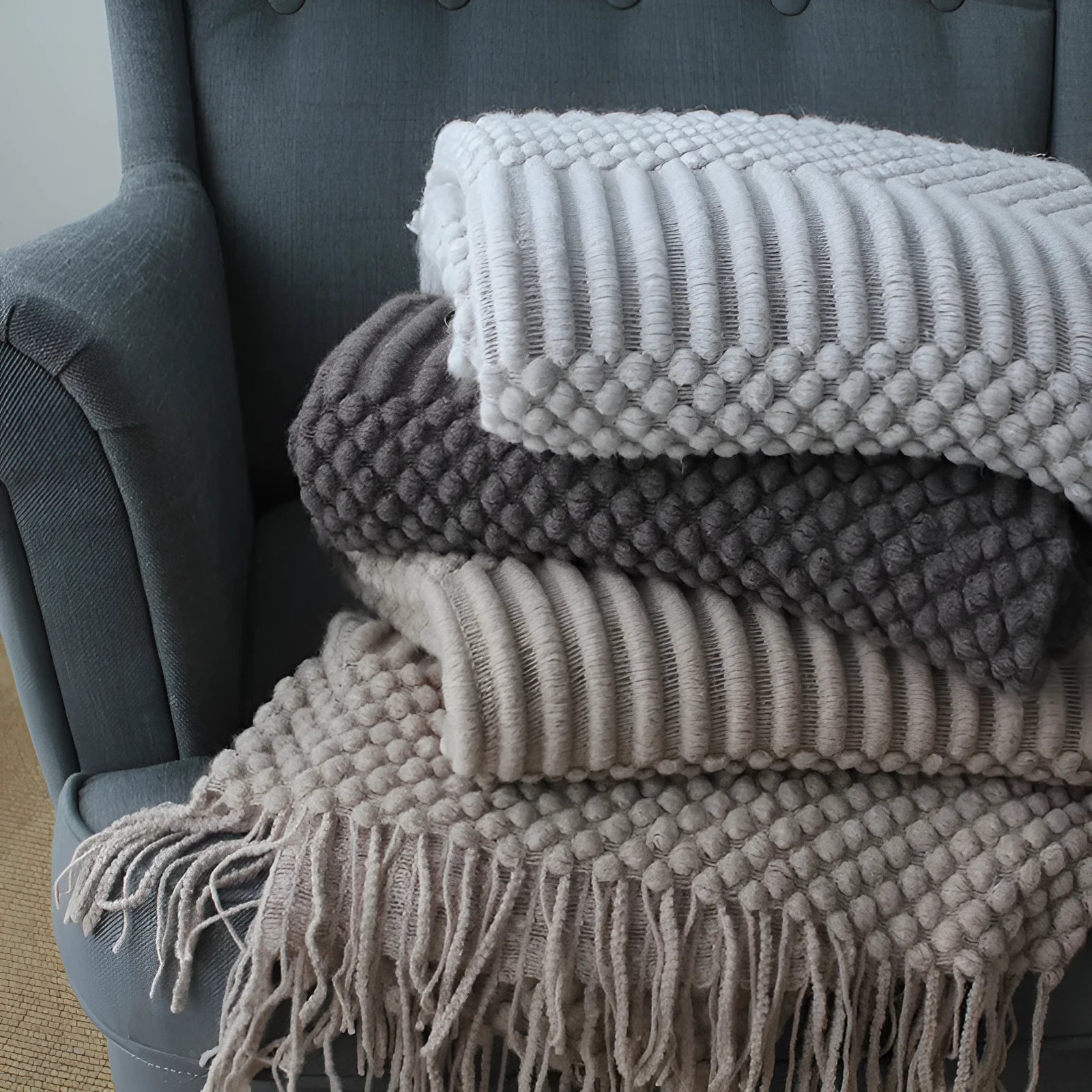 Polyester small blanket shown in dark grey, measuring 127 by 170 centimetres.