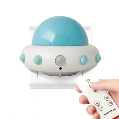 Remote control UFO bedside night light in blue, pink, or white colours with compact 105mm x 76mm dimensions