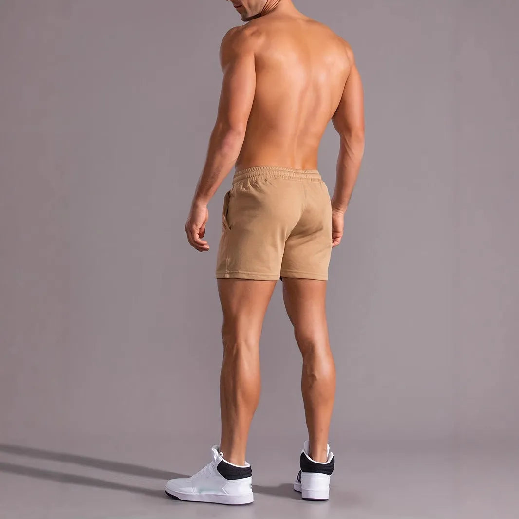 Khaki coconut print men's sports shorts with elastic waistband and straight leg design