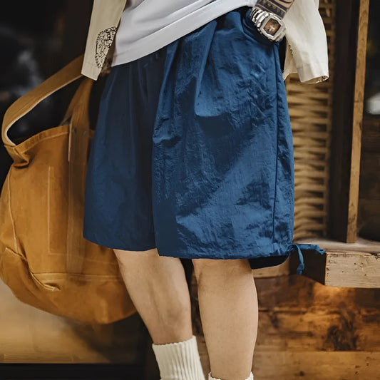 Men's Prussian blue embroidered loose-fit summer shorts on hanger
