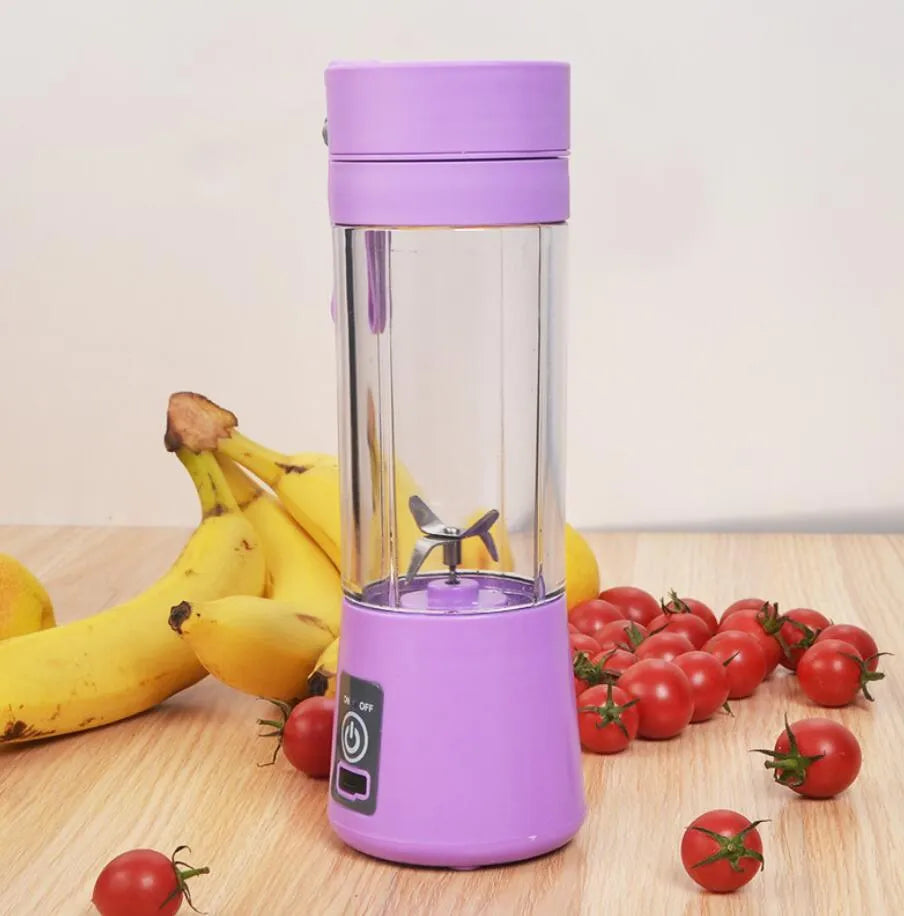 Pink portable USB electric fruit juicer blender cup with stainless steel blade and carry handle.