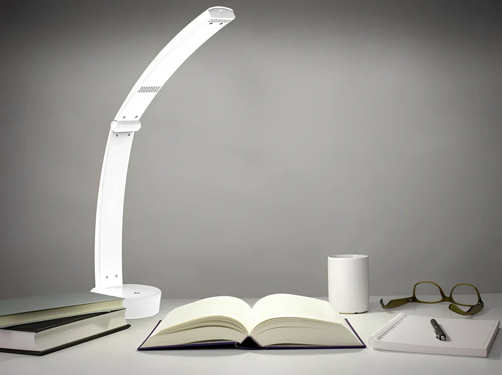 White folding LED desk lamp with touch control on wooden desk