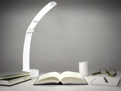 White folding LED desk lamp with touch control on wooden desk