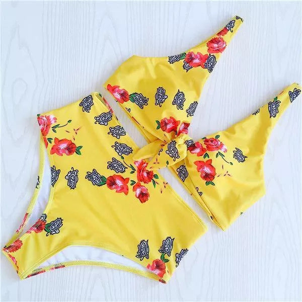 Double-sided knotted bikini swimsuit in yellow, orchid, and white floral patterns