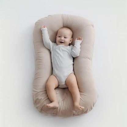 Beige portable cotton baby nest crib measuring 75 by 45 centimetres for newborn infants