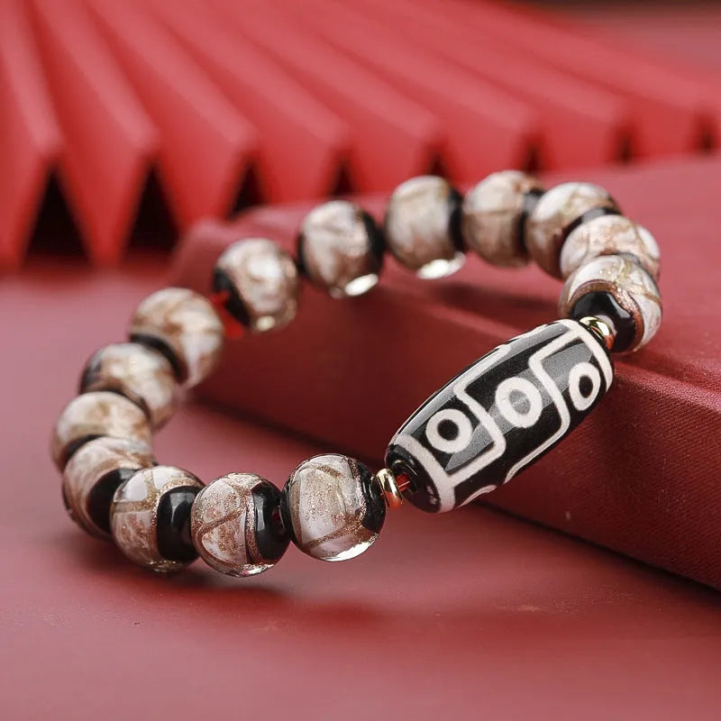 Colourful Chinese-style coloured glaze bracelet with auspicious patterns and snake symbol on beads.