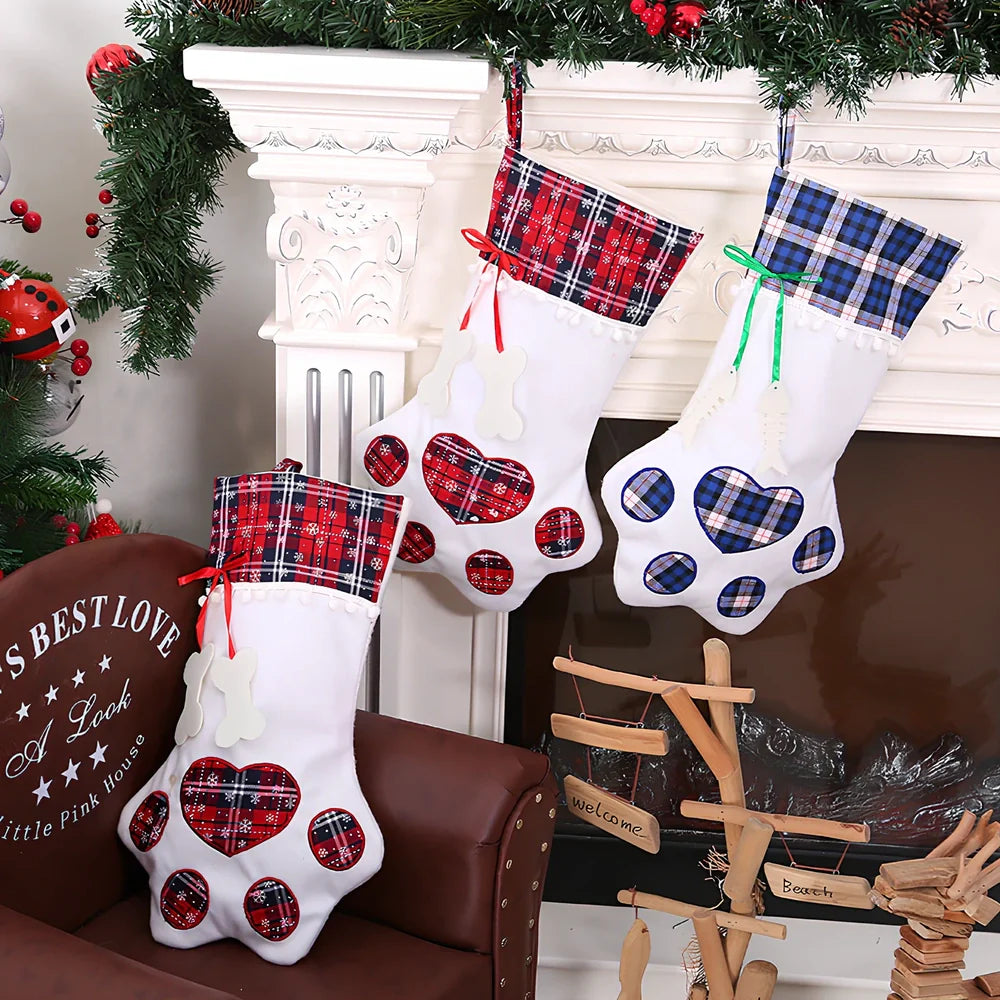 Red dog paw shaped Christmas stocking measuring 20cm by 46cm with reinforced hanging loop