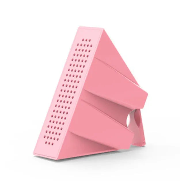Portable black ABS plastic phone amplifier bracket holding a smartphone on a desk.