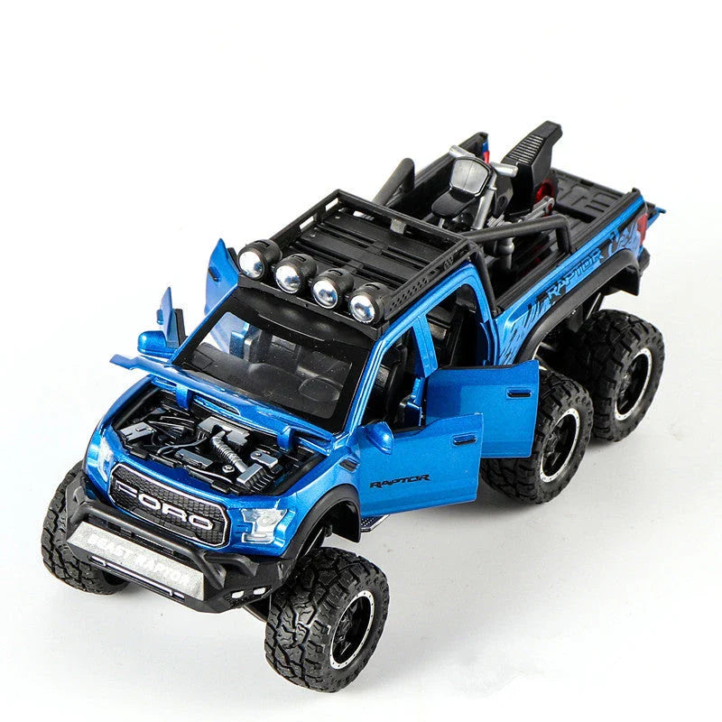 Realistic 1:28 scale Ford Raptor toy car with alloy body, lights, sounds, and pull-back action feature
