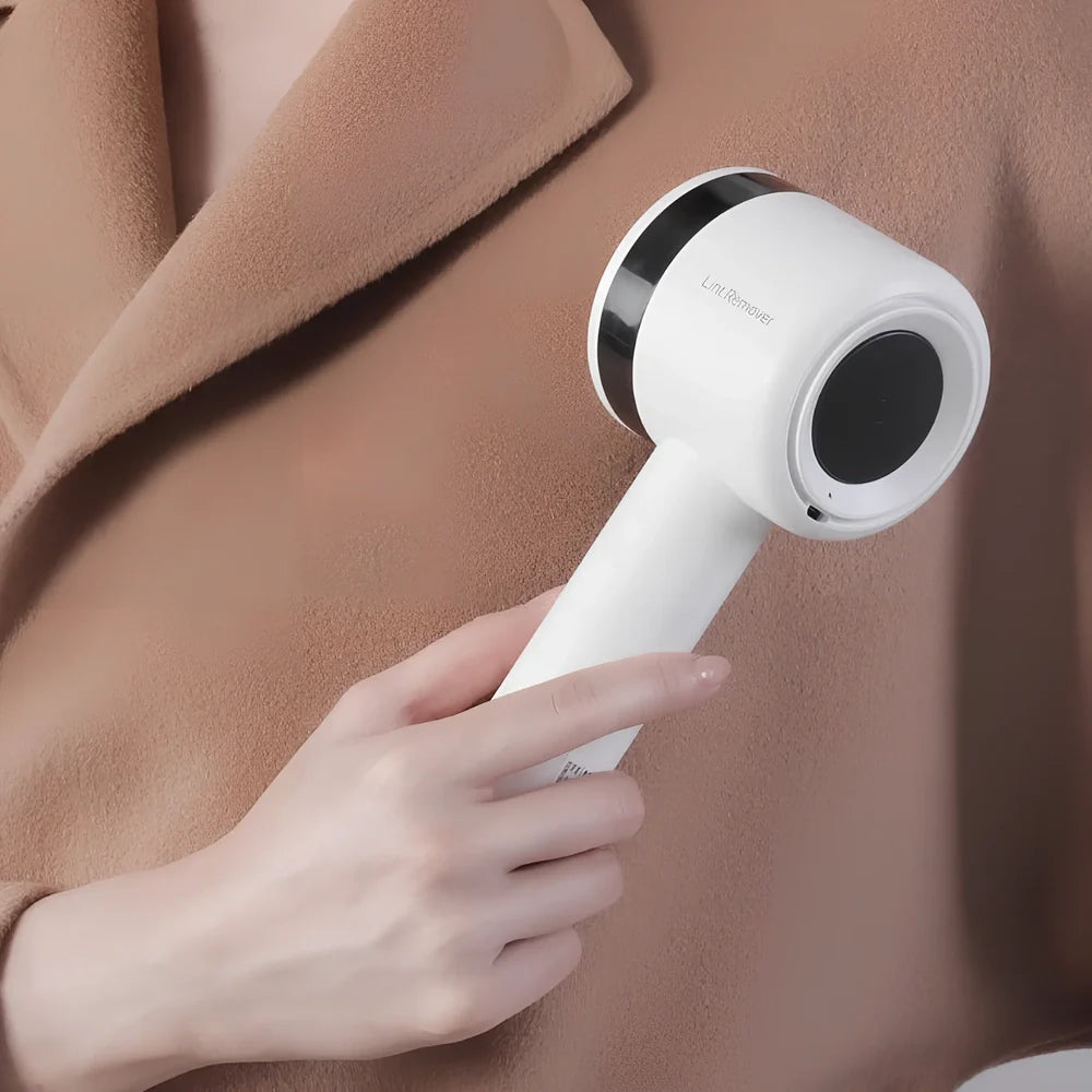 White rechargeable lint remover with detachable head and USB charging cable