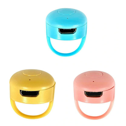 Bluetooth Remote Control Ring for mobile phones in yellow, blue, and pink colors