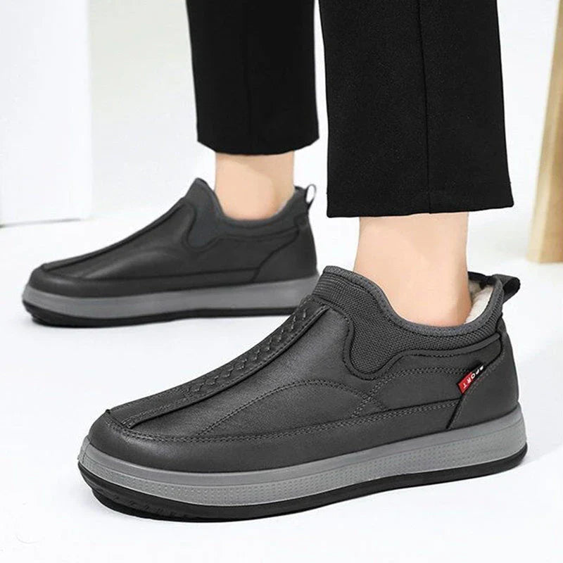 Cozy winter snow boots with fleece lining, round toe, and non-slip platform sole in black and grey colors