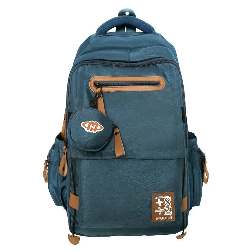 Large nylon school backpack for middle school students in a solid colour with curved shoulder straps.
