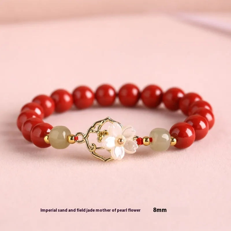 Handcrafted Hetian Jade New Chinese style bracelet in cinnabar with white butterfly, lotus and bells of Ireland motifs