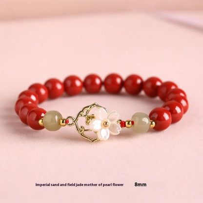 Handcrafted Hetian Jade New Chinese style bracelet in cinnabar with white butterfly, lotus and bells of Ireland motifs