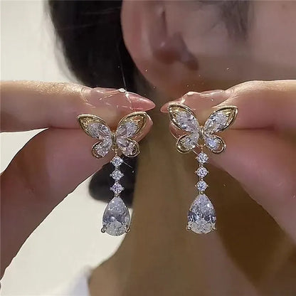 Bow stud earrings with platinum electroplated finish on zinc alloy