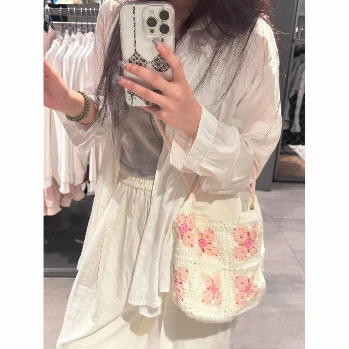 Handmade cotton crochet handbag with cherry blossom pattern and magnetic buckle closure
