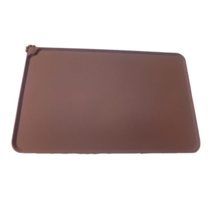 Silicone pet food mat with raised edges and non-slip base to contain messes and protect floors during pet mealtimes