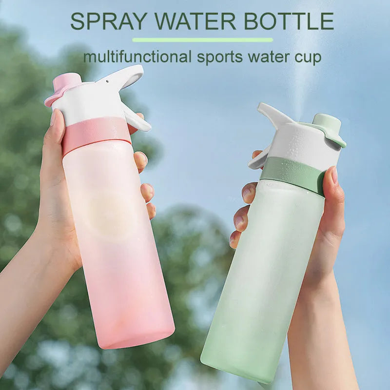 Large plastic spray water bottle with handle strap and leakproof lid in green colour.