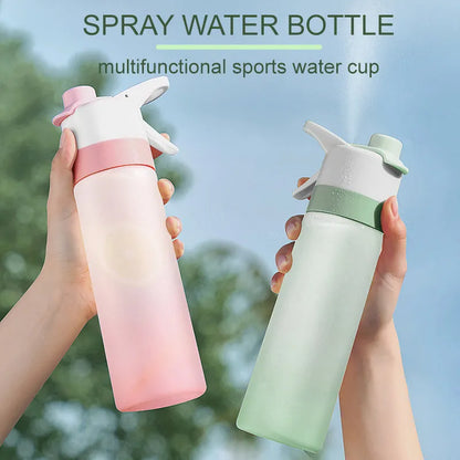 Large plastic spray water bottle with handle strap and leakproof lid in green colour.