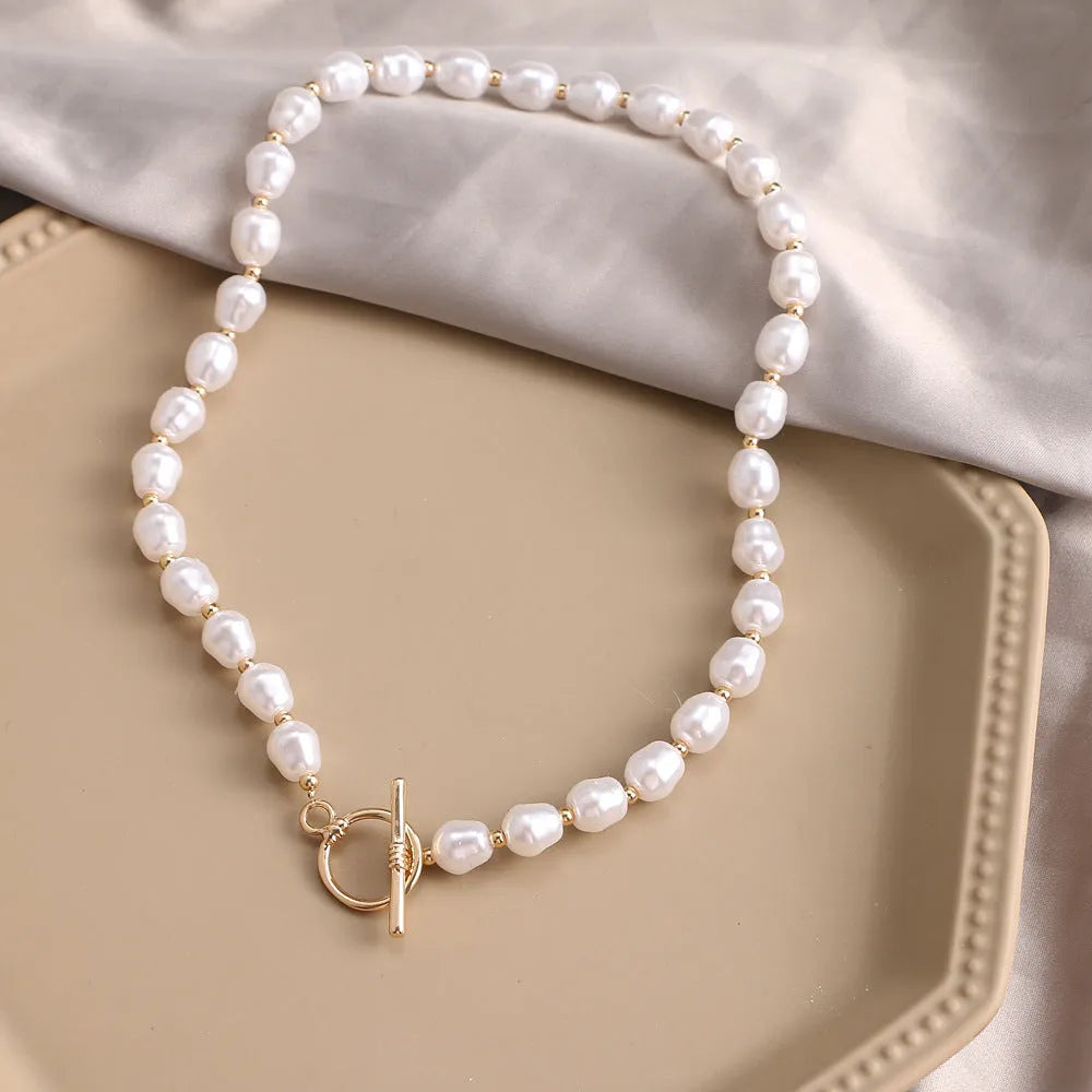 Vintage gold heart pendant necklace on a textured pearl chain, adjustable 41-50cm length.