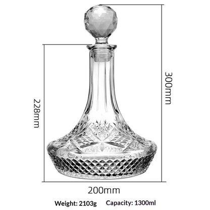 Hand-cut Bohemian crystal whiskey decanter with retro design and tapered pouring neck on wooden bar