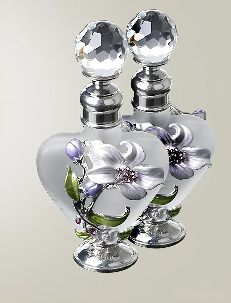 Heart-shaped refillable perfume bottle with metal and crystal construction, 3.6 inches tall