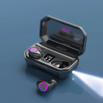 Black and white wireless Bluetooth in-ear headphones with a charging cabin showing an LED power display.