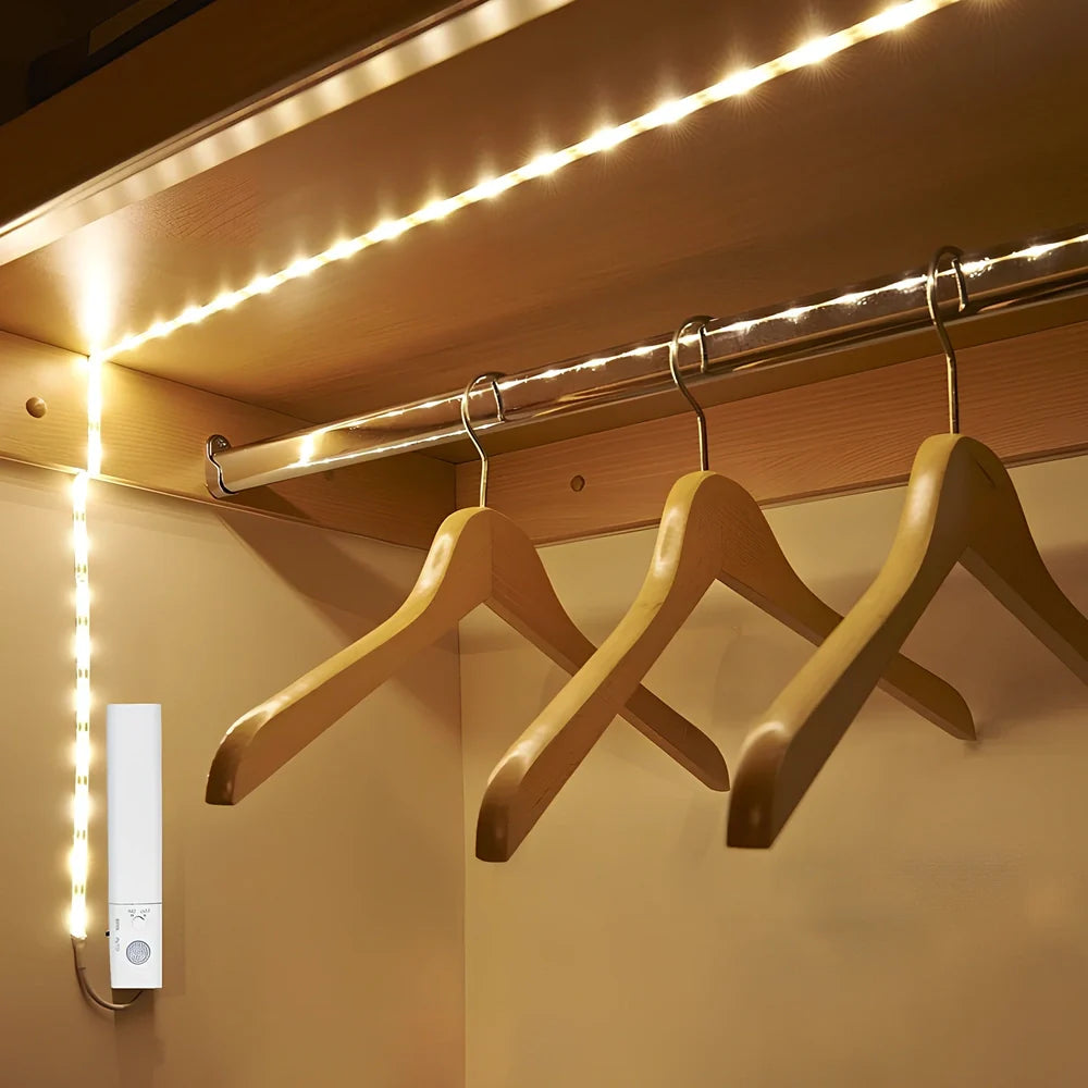 LED human induction bed lamp strip with remote control, 8mm width, showing yellow cut marks for custom length adjustment