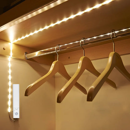 LED human induction bed lamp strip with remote control, 8mm width, showing yellow cut marks for custom length adjustment
