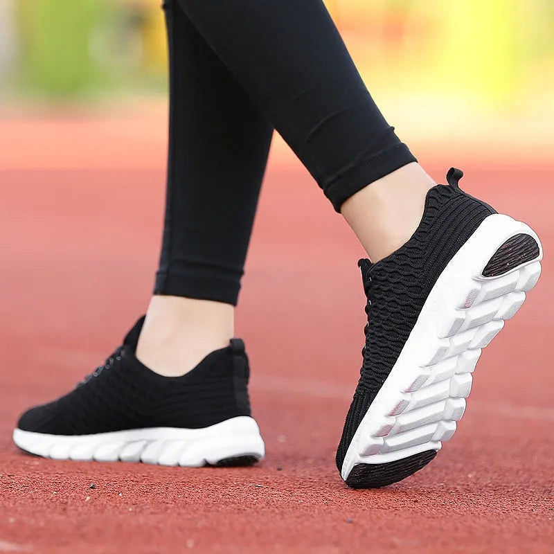 Women's running shoes with fly weaving upper material and wear-resistant outsole in black, pink, white colours