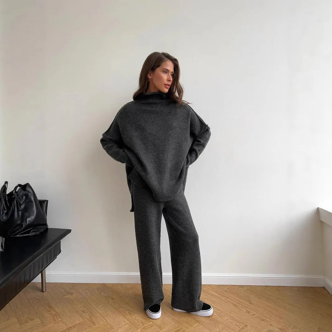Women's acrylic side-slit sweater suit in dark grey, featuring a top and trousers for a coordinated two-piece set.
