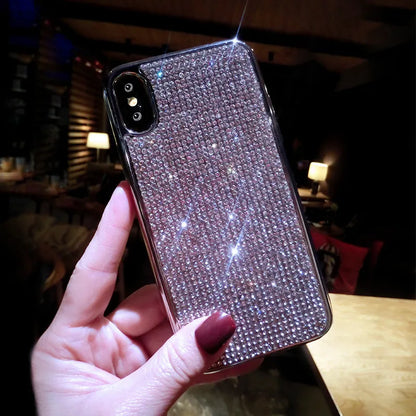 Silver silicone phone case with sparkling diamond decoration for various iPhone models.