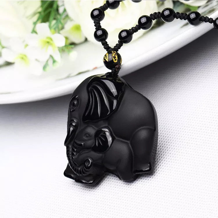 Hand-carved obsidian elephant pendant necklace with stretch bead chain for wealth and protection