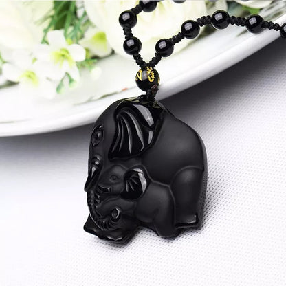 Hand-carved obsidian elephant pendant necklace with stretch bead chain for wealth and protection