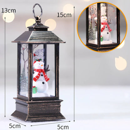 Compact 13cm Christmas LED flame small oil lamp in snowman motif on wooden shelf, square plastic base with flickering electronic light