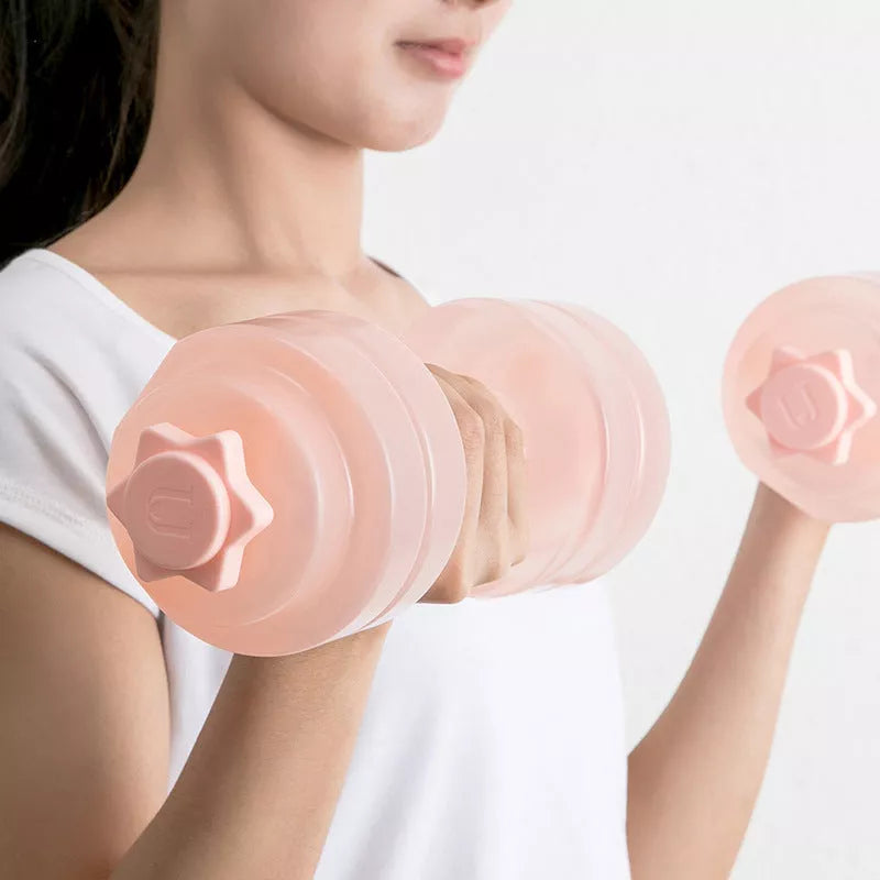 Mini Portable Plastic Water Dumbbell in transparent pink and light gray for adjustable resistance workouts