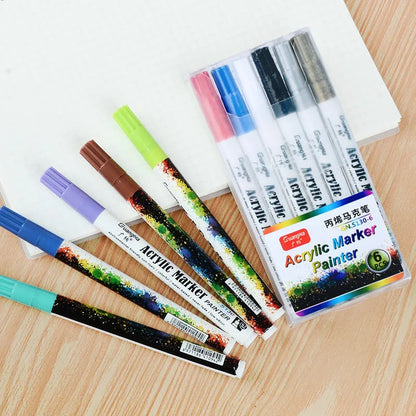 Set of six colourful acrylic paint marker pens with 0.7mm nibs in a plastic box.