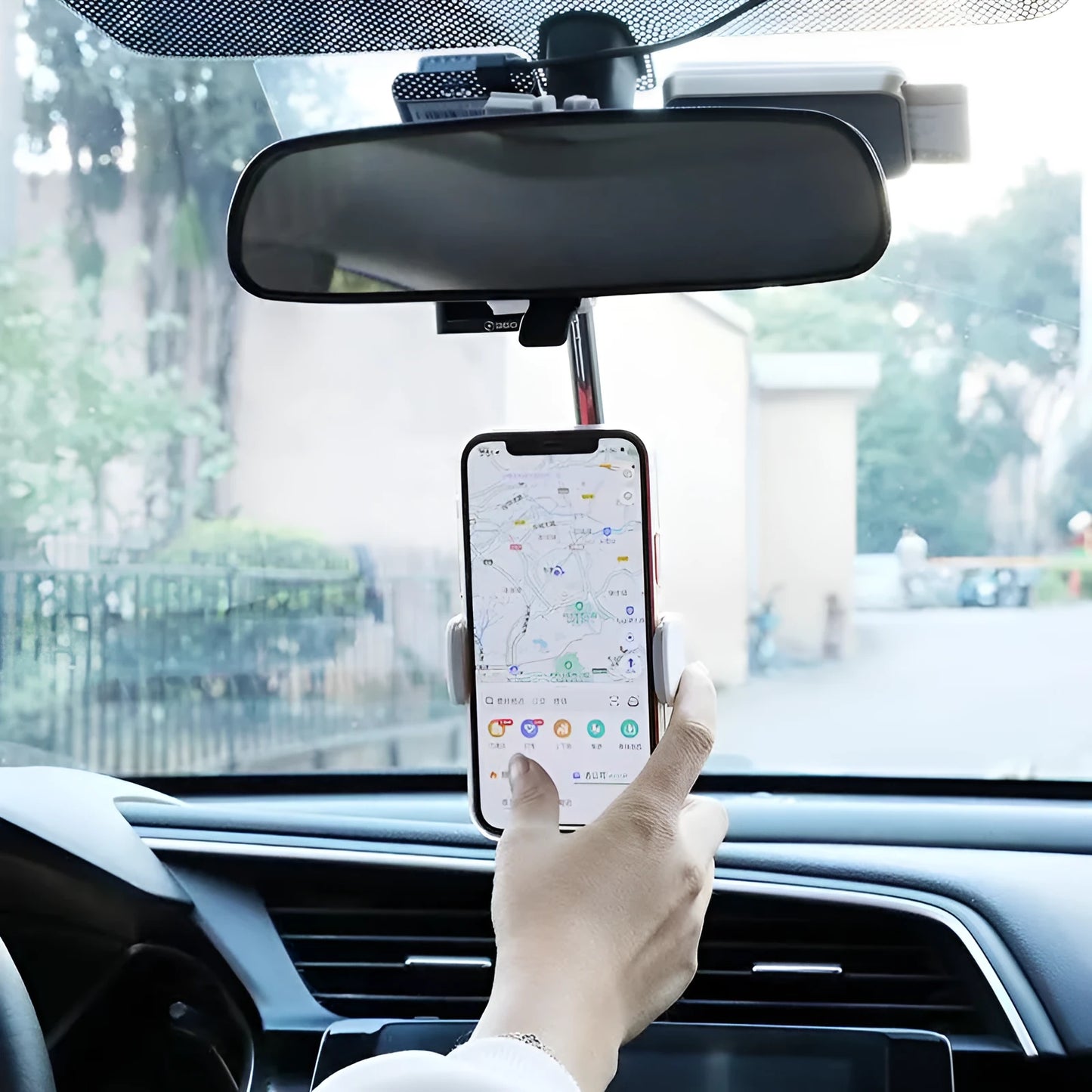 Black ABS plastic mobile phone bracket mounted on a car rearview mirror.