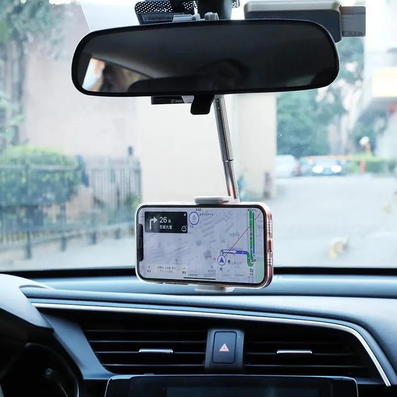 Black ABS plastic mobile phone bracket mounted on a car rearview mirror.