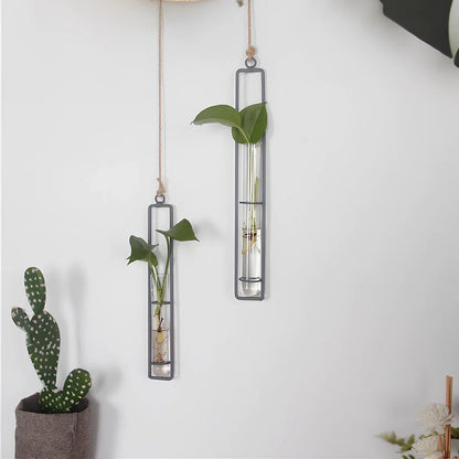Grey wrought iron and glass hydroponic vase with hemp rope hanging three test tubes vertically