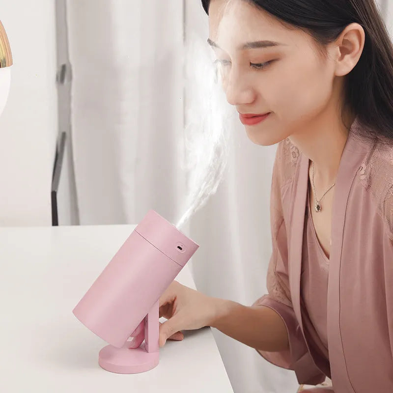 White USB desktop humidifier with folding bracket on wooden desk