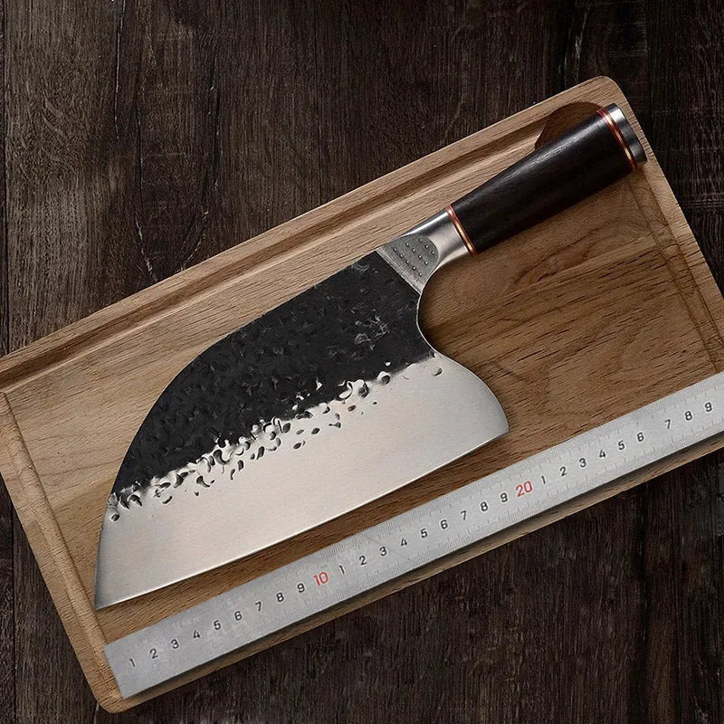 High chromium steel chef's knife with ebony wood handle for cutting meat and bones.