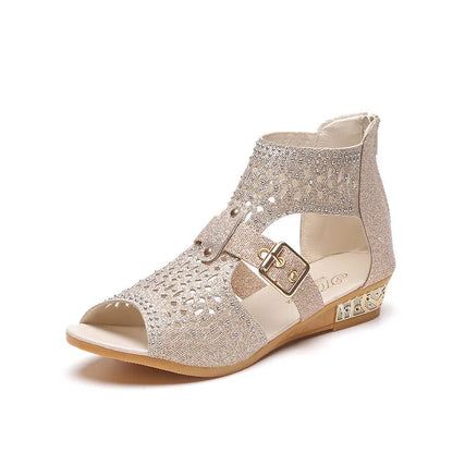 Women's flat sandals with back zipper, wedge heel, and fish mouth toe in beige, black, and gold colours