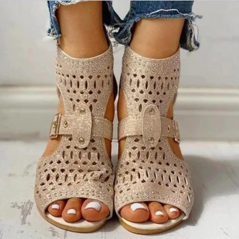 Women's flat sandals with back zipper, wedge heel, and fish mouth toe in beige, black, and gold colours