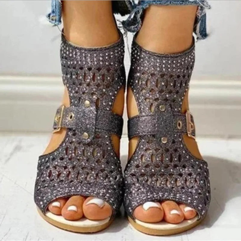 Women's flat sandals with back zipper, wedge heel, and fish mouth toe in beige, black, and gold colours