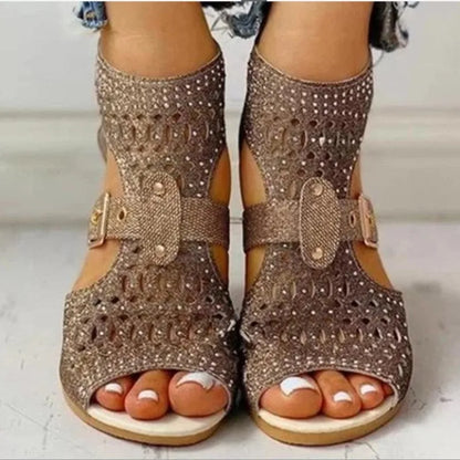 Women's flat sandals with back zipper, wedge heel, and fish mouth toe in beige, black, and gold colours